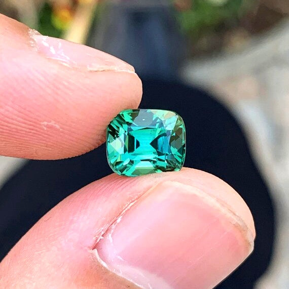 Bi-color elbaite tourmaline gemstone side view
October birthstone tourmaline loose stone for sale