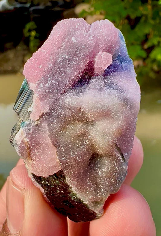 Rose quartz and pink tourmaline crystals side by side showing color and clarity differences