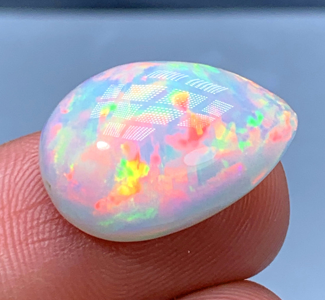 Natural Ethiopian opal cabochon with rainbow flashes