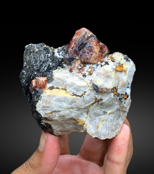 Natural red zircon crystal on matrix specimen