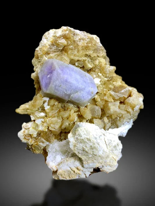 Natural hackmanite crystal specimen showing violet color