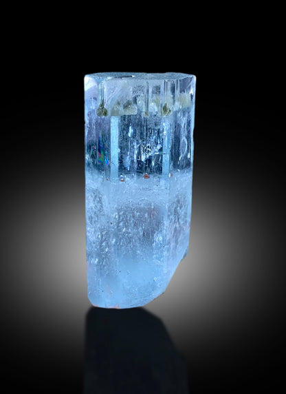 52 gram aquamarine crystal with an intact termination
Aquamarine crystal held up to show its transparency