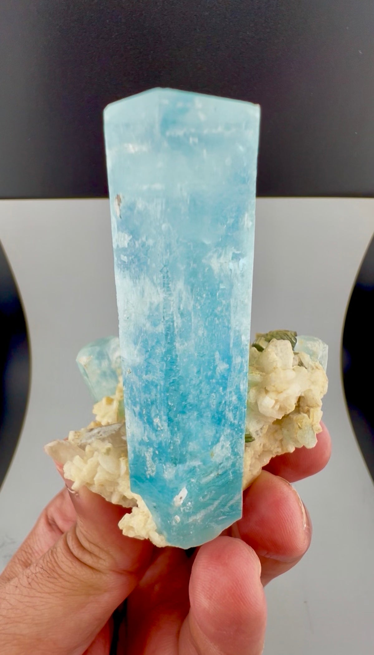 Aesthetic aquamarine mineral specimen, front angle
Aquamarine crystal cluster with feldspar base, side view