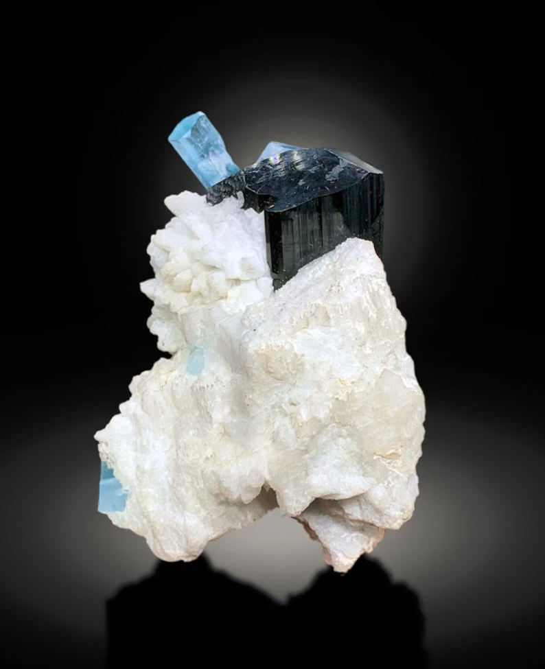 Black schorl tourmaline crystals beside aquamarine
Afghanistan aquamarine specimen mounted on base
Natural untreated aquamarine crystal specimen