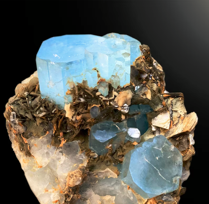 Aquamarine crystal faces showing blue color and luster
Gilgit Baltistan Pakistan aquamarine cluster detail
Natural untreated aquamarine crystal cluster specimen