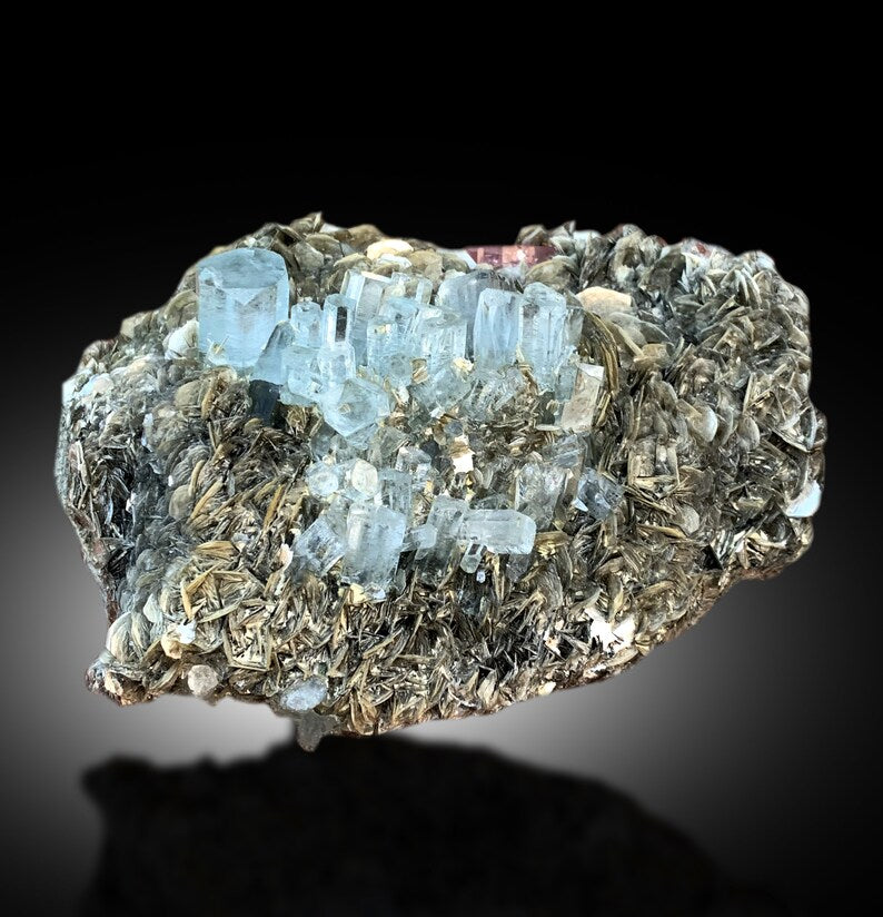 Aquamarine crystals with excellent luster, macro view
Natural aquamarine and apatite specimen, top view