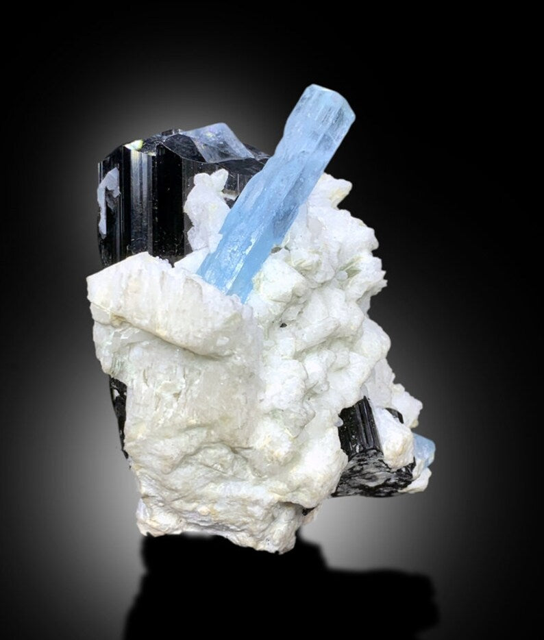 Aquamarine specimen dimensions 82 by 75 by 58 mm
Aquamarine specimen back angle view on base