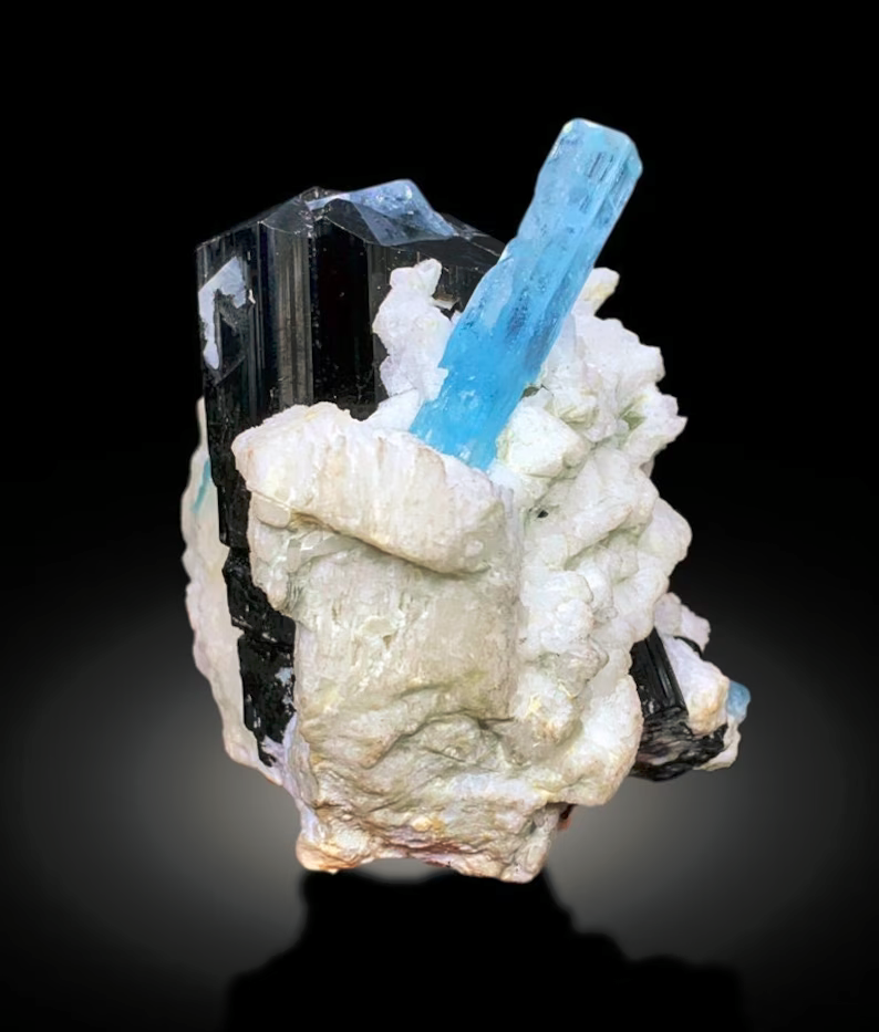 Closeup of aquamarine crystal termination and luster
Aquamarine specimen on acrylic base side view