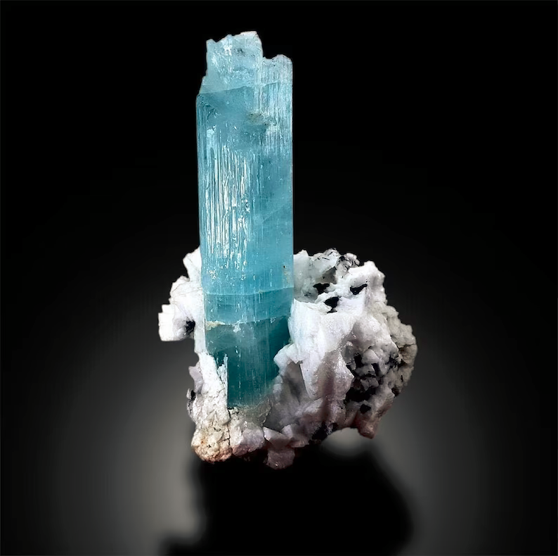 Closeup of aquamarine crystal termination and luster
Aquamarine specimen self standing side view