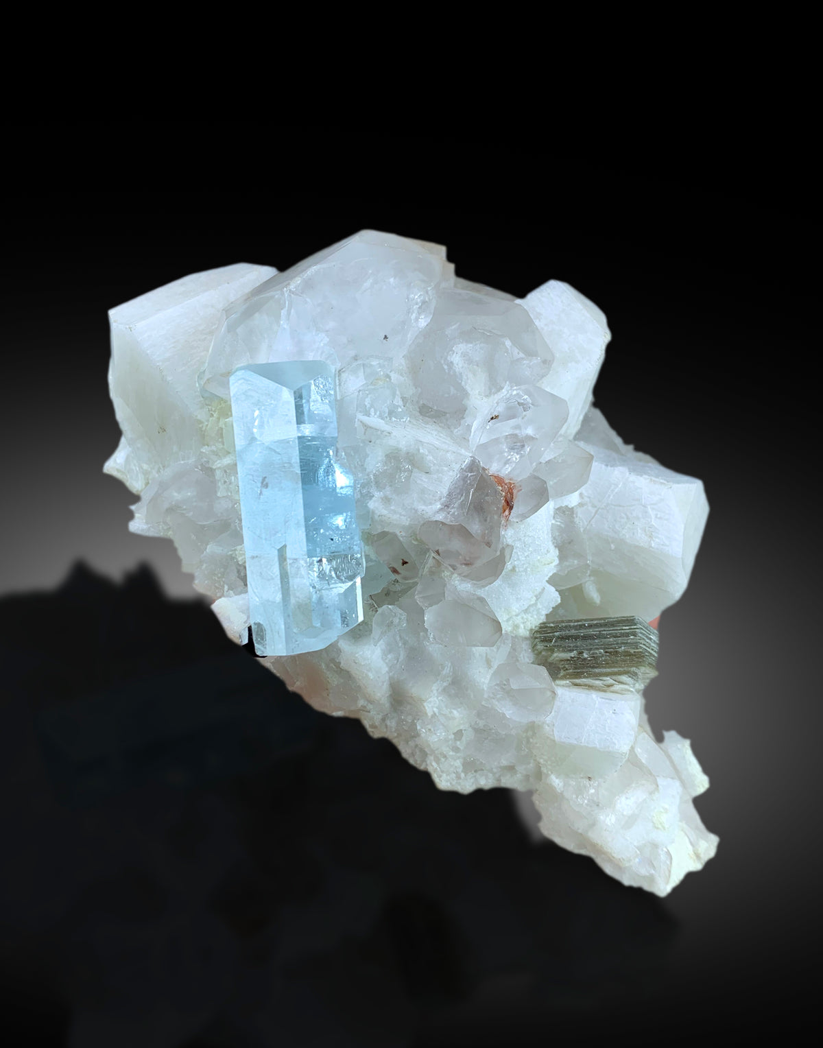 Closeup of aquamarine crystal termination and luster
Aquamarine specimen with microcline feldspar side view