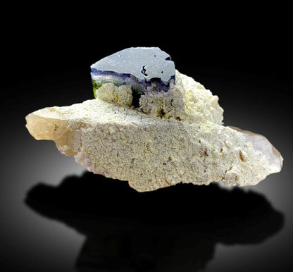 Blue cap tourmaline showing blue purplish green color zones
