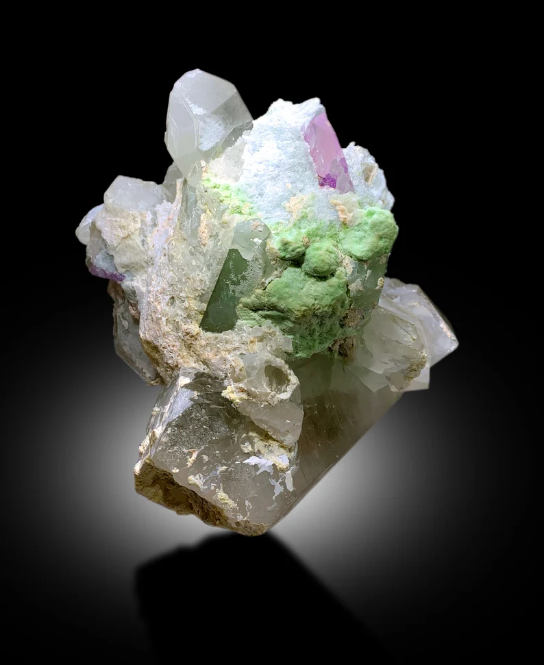 Cleavelandite albite matrix with pink and green crystals
Afghanistan combination mineral specimen detail view
