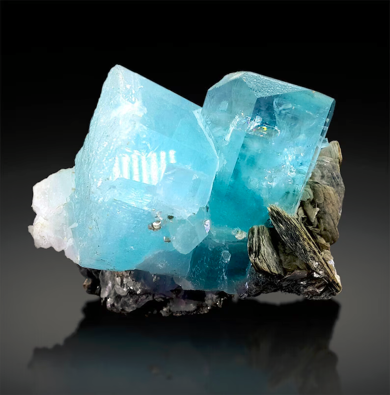 Closeup of aquamarine crystal termination and luster
Aquamarine crystal on muscovite mica side view