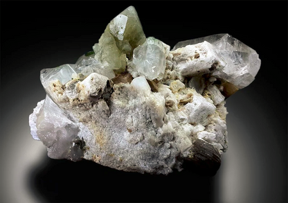 Closeup of herderite crystal cluster termination
Herderite with tourmaline and topaz side view