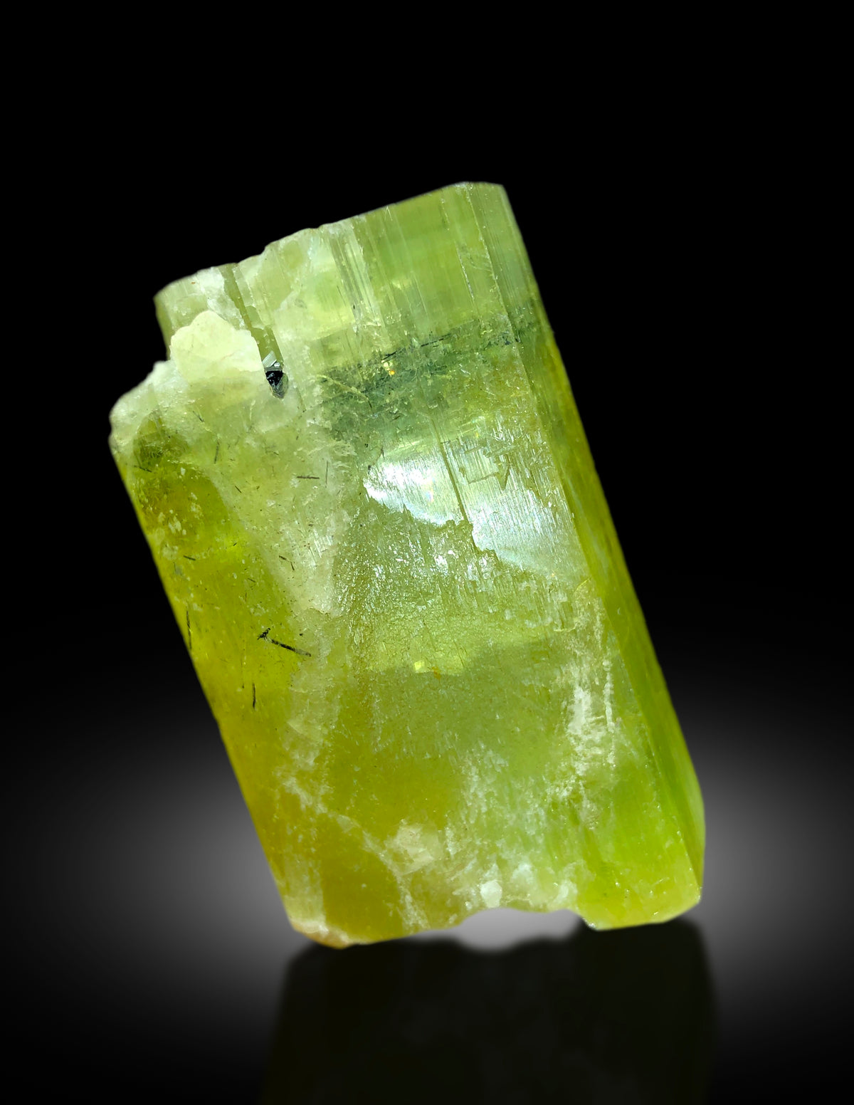 Raw heliodor crystal on display
Collector grade heliodor specimen from Pakistan
Heliodor crystal lighting and color detail