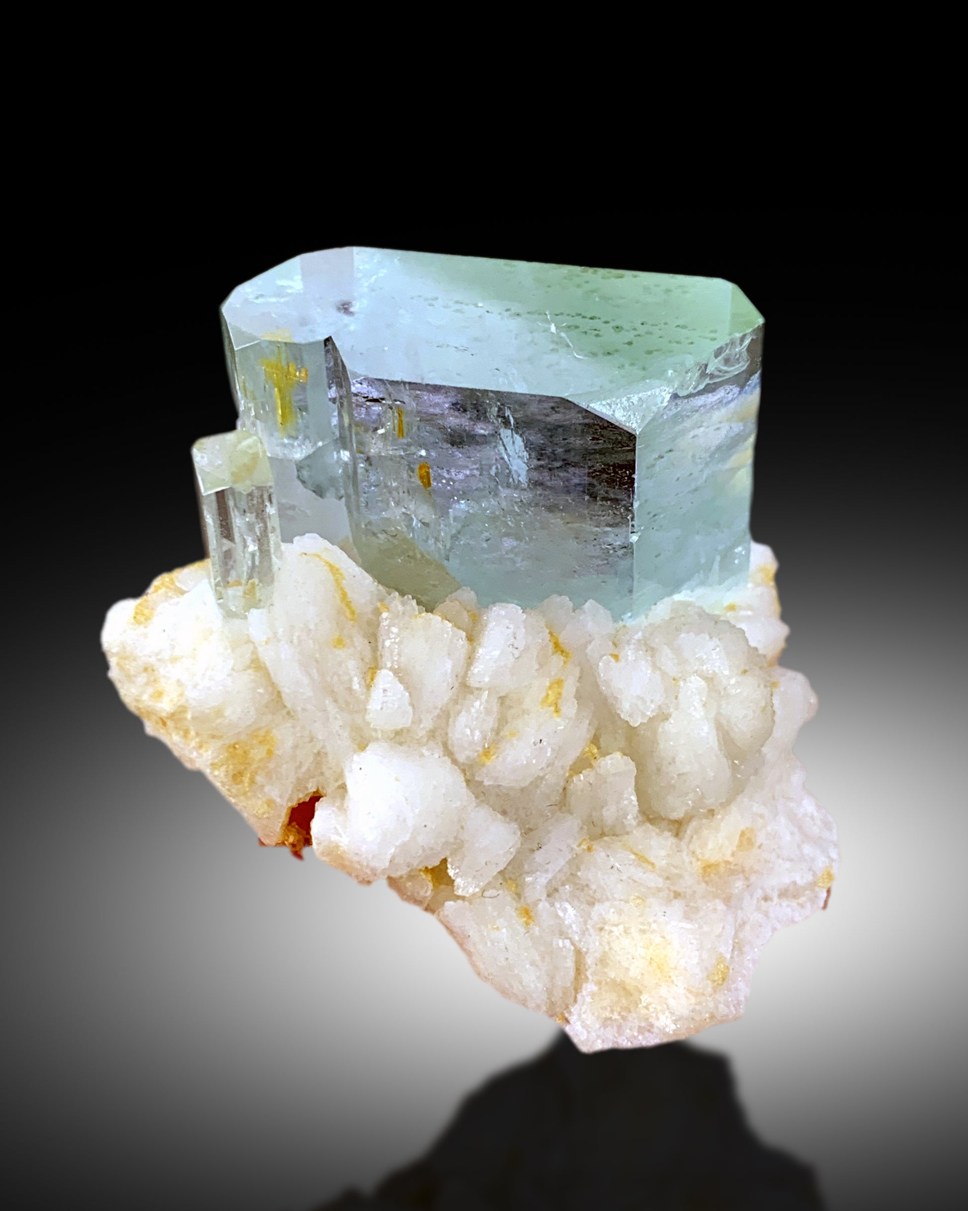 Compact 43 gram aquamarine albite specimen top view
Aquamarine transparency second video angle natural light
