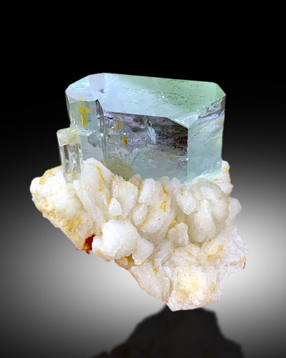 Compact 43 gram aquamarine albite specimen top view
Aquamarine transparency second video angle natural light