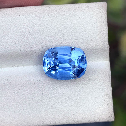 Deep blue aquamarine faceted gemstone close-up
Long cushion aquamarine loose stone 12x9mm