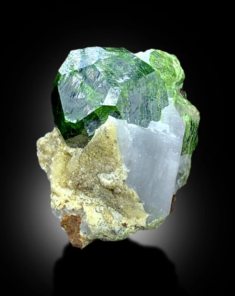 Demantoid garnet crystal lighting and dispersion detail
Natural terminated crystal free of chips or damage
Demantoid garnet mineral specimen full length view
71.55 carat demantoid garnet complete profile
Rare green demantoid garnet from Koh e Belgheys