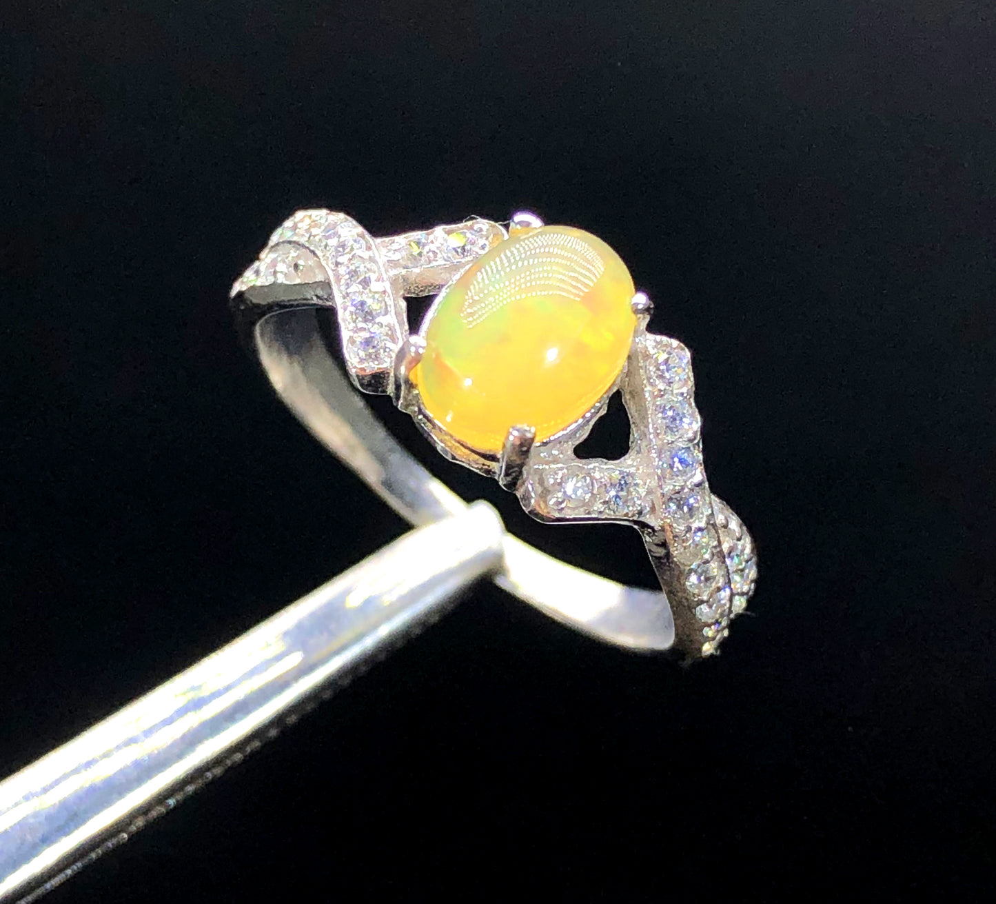 Ethiopian Welo opal ring play-of-color with zircon accents
Natural opal and zircon ring 25x21mm centerpiece