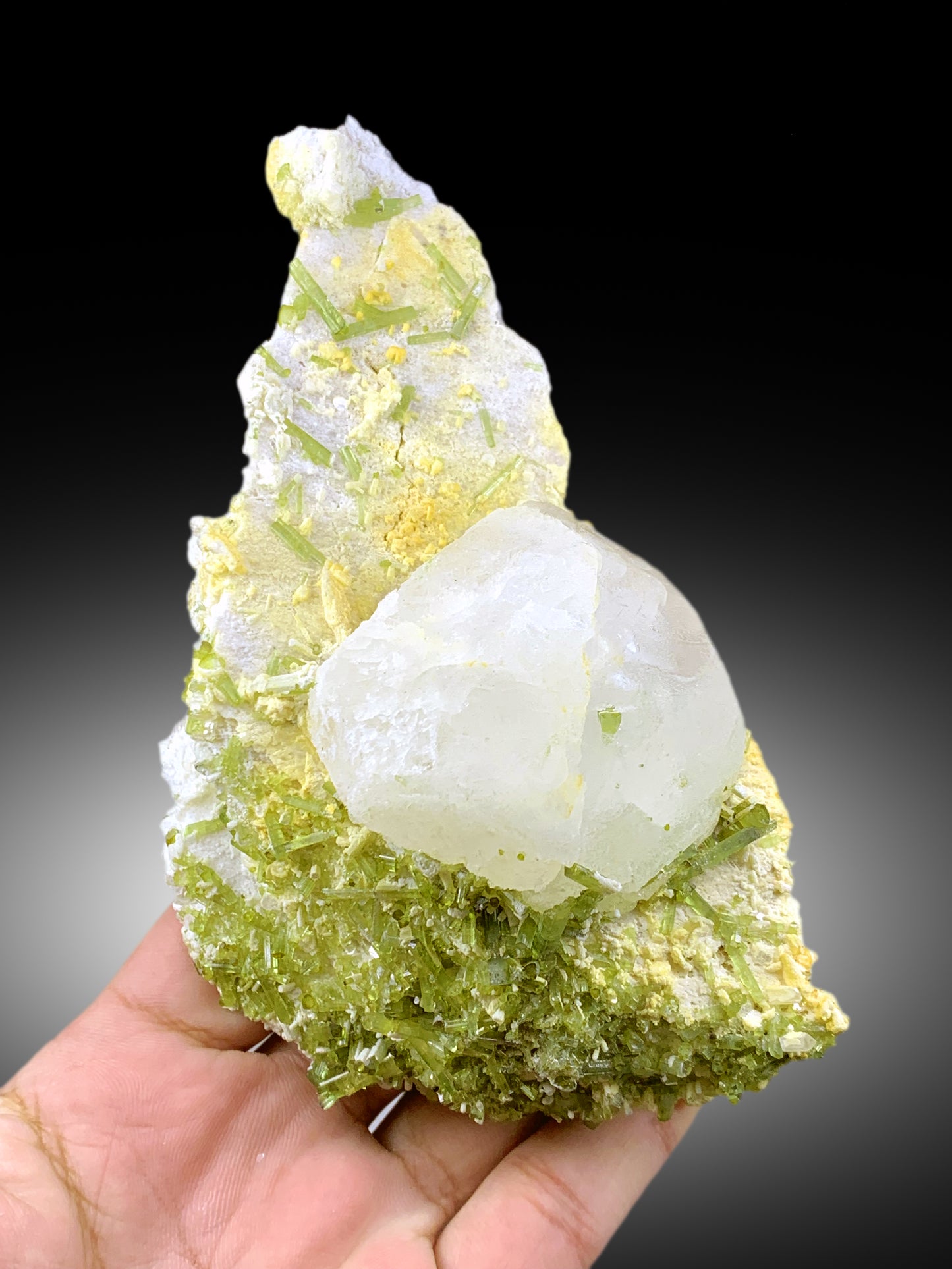 Feldspar matrix under green tourmaline crystals
Standing aesthetic position of tourmaline mineral specimen