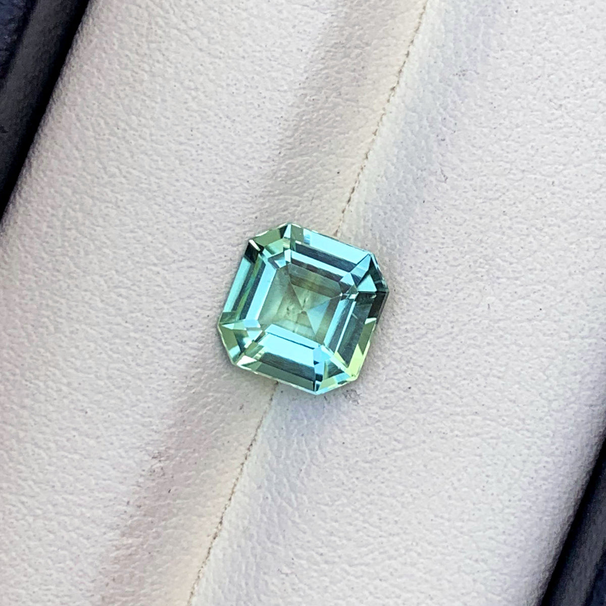 Flawless tourmaline loose stone, front angle view
Sea foam color tourmaline, faceted detail view