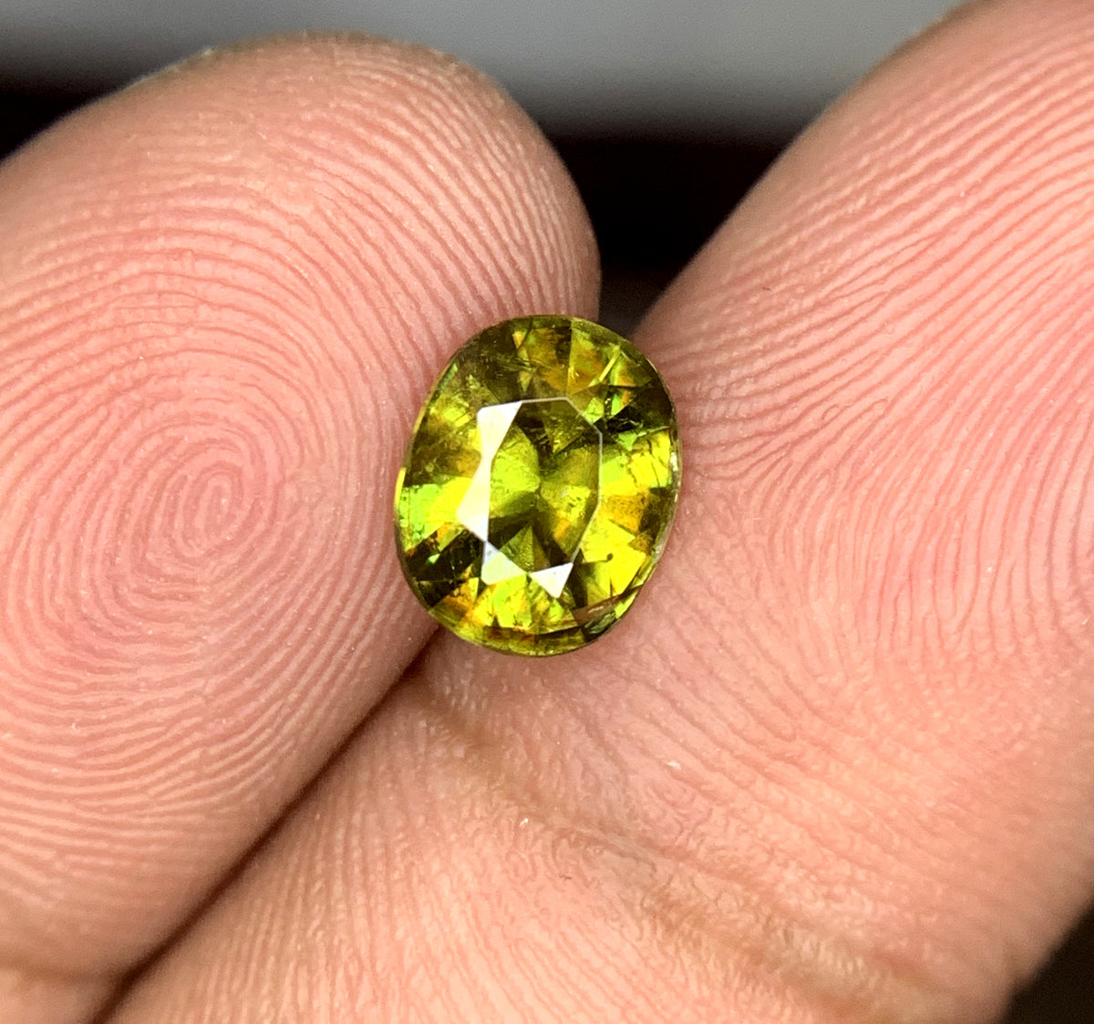 Full fire sphene stone showing color and brilliance
Oval sphene loose gemstone, ring-ready cut
Titanite sphene gemstone, faceted detail view