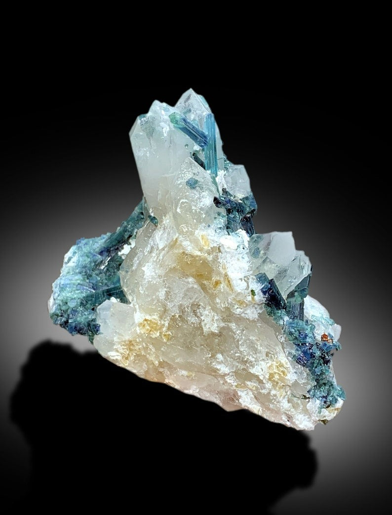 Full profile of blue tourmaline on quartz matrix
Tourmaline crystal faces showing gem grade luster