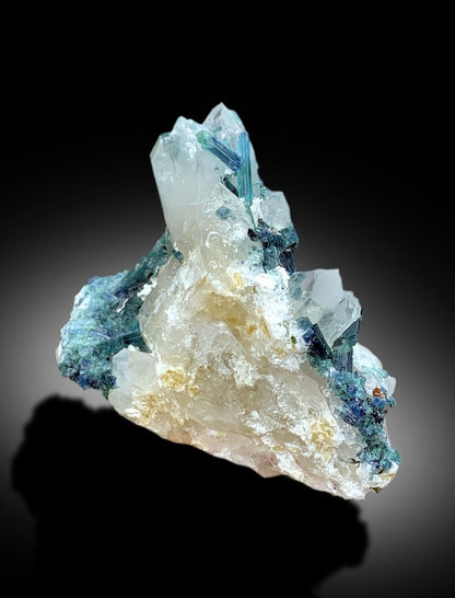 Full profile of blue tourmaline on quartz matrix
Tourmaline crystal faces showing gem grade luster