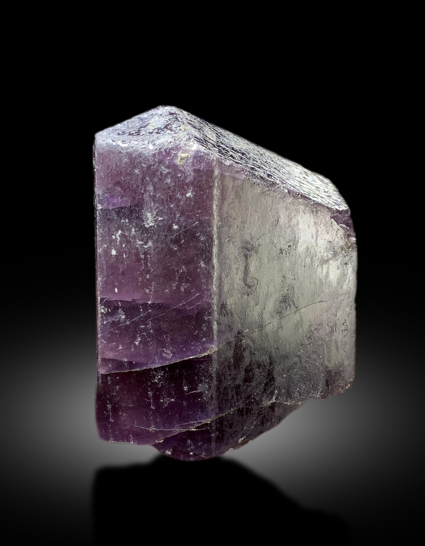 Purple scapolite crystal with scale reference for size