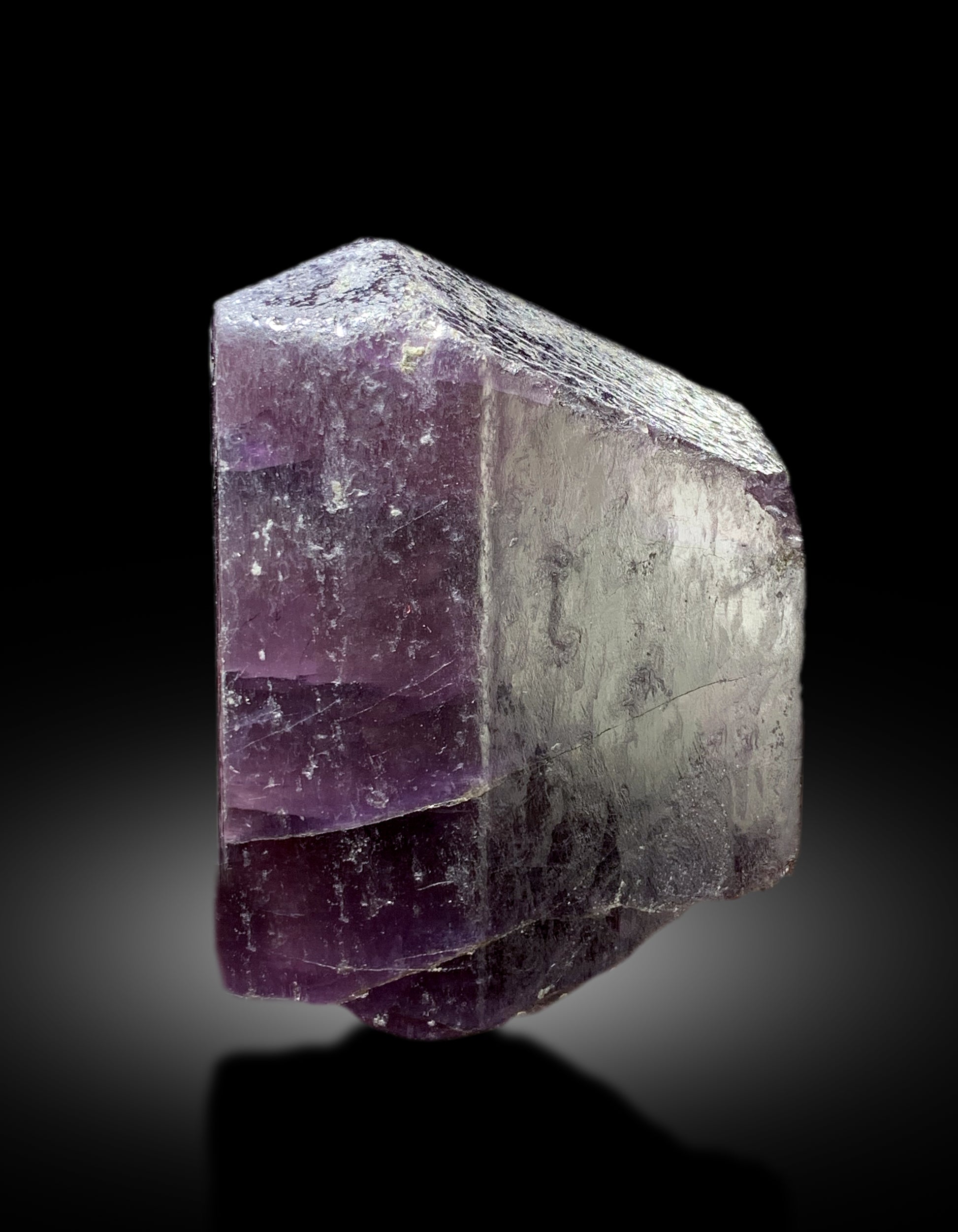 Purple scapolite crystal with scale reference for size