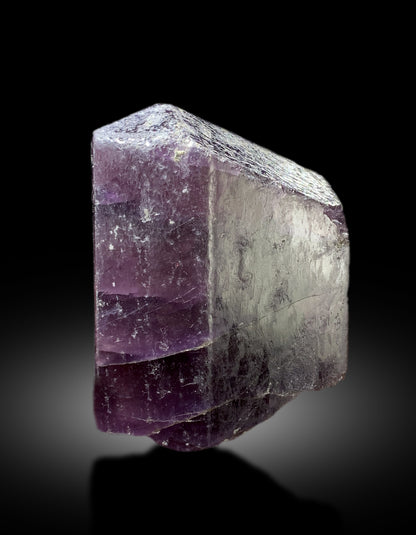 Purple scapolite crystal with scale reference for size