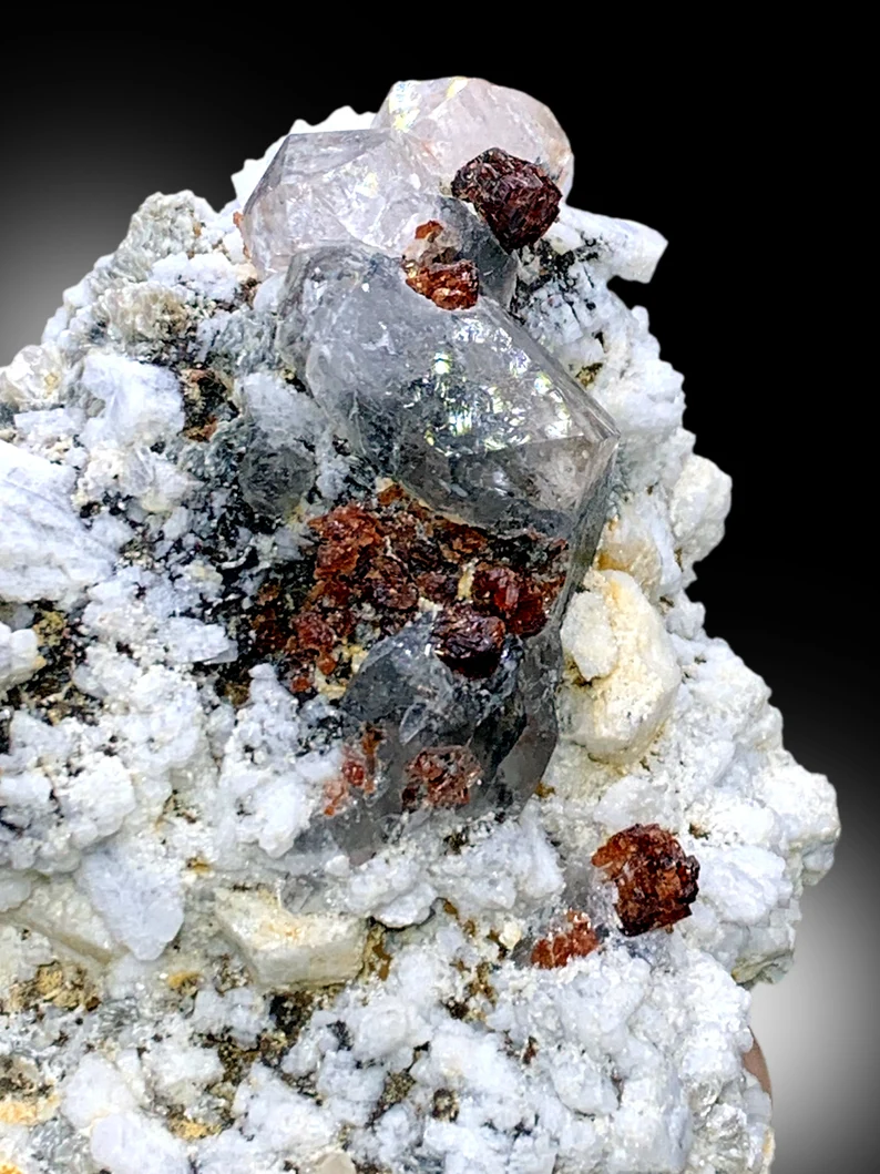 Garnet with feldspar matrix, 101x89x61mm, full view
Self standing red garnet specimen, display angle
Natural garnet crystal cluster, side profile
Red garnet on quartz, top down view