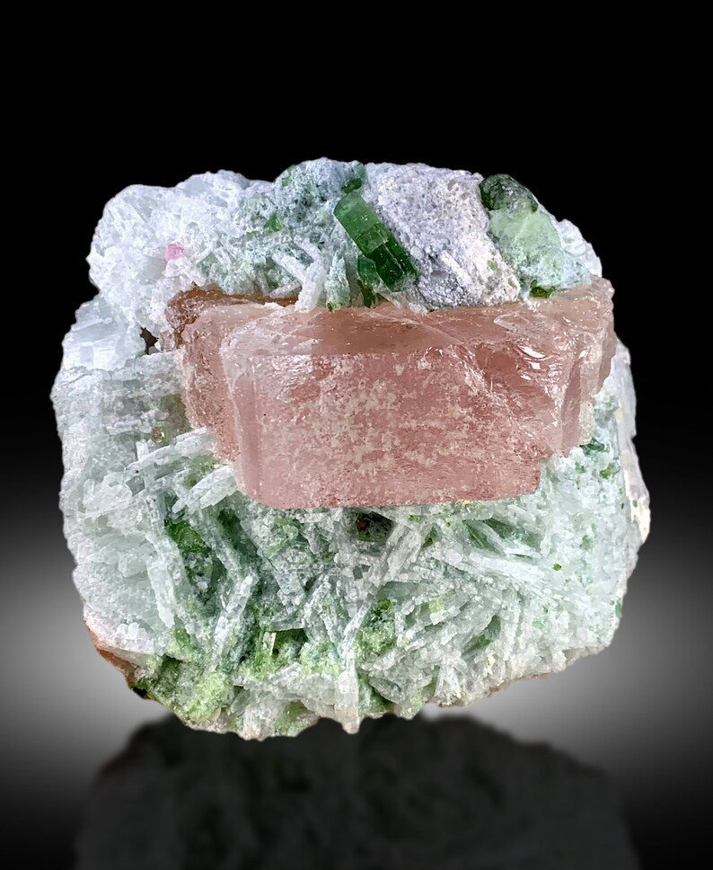 Green tourmaline crystal cluster on albite matrix
Pakistan morganite specimen full detail view
Natural untreated morganite and tourmaline specimen