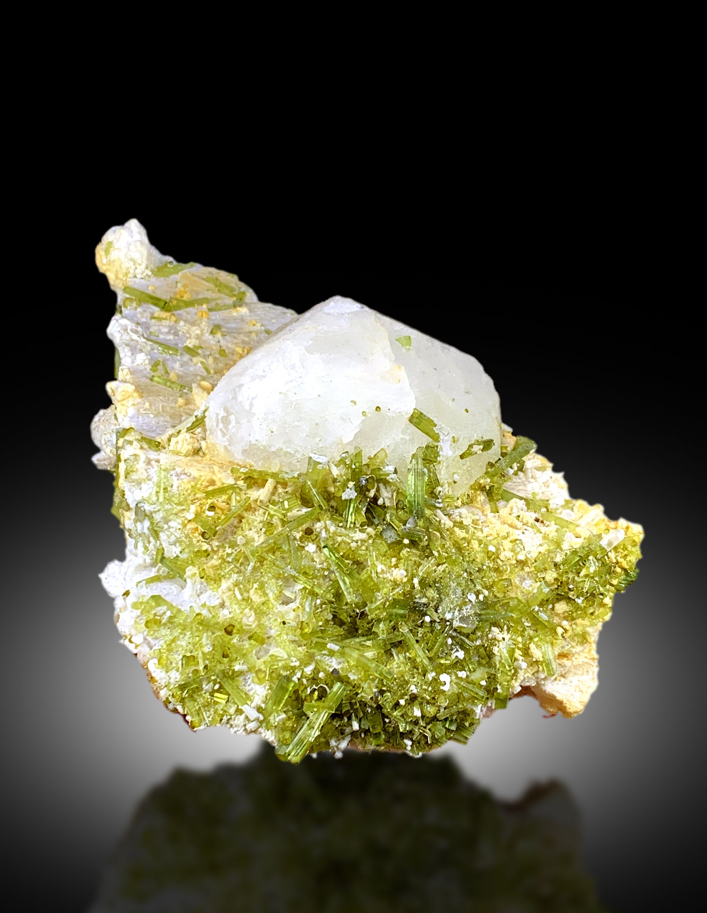 Green tourmaline crystal terminations closeup shot
Tourmaline and feldspar matrix natural formation