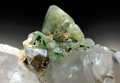 Green tourmaline crystals beside herderite cluster
Skardu Pakistan combination specimen detail view
Natural untreated multi-mineral crystal specimen