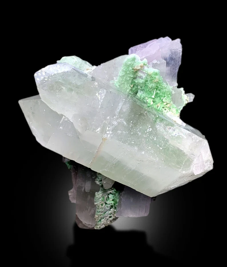 Green tourmaline crystals on kunzite matrix
Double terminated quartz crystal on kunzit