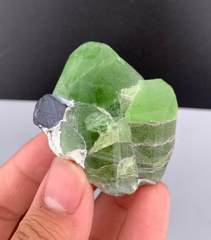 Lush Green Peridot Crystal With Magnetite From Pakistan - 60 Grams