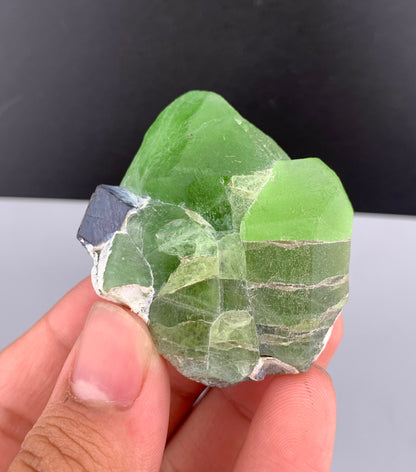 Lush Green Peridot Crystal With Magnetite From Pakistan - 60 Grams