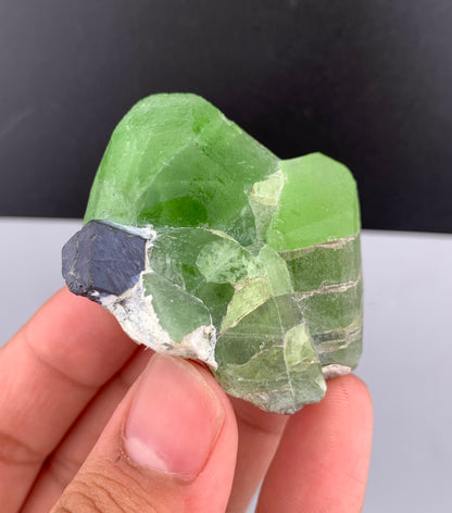 Lush Green Peridot Crystal With Magnetite From Pakistan - 60 Grams