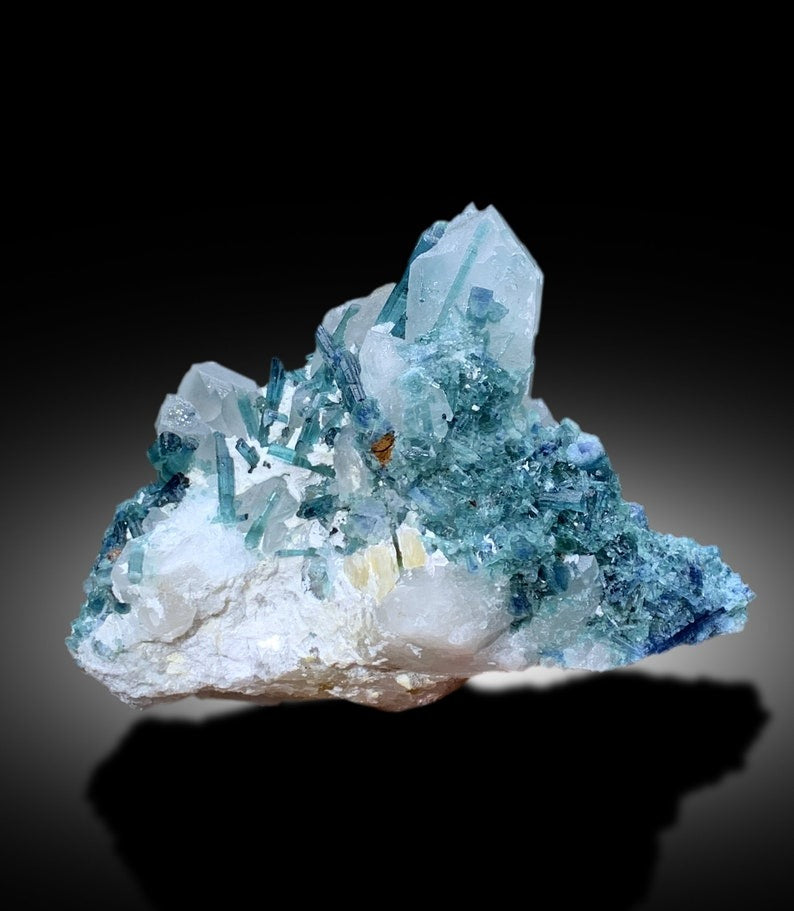 Indicolite tourmaline cluster with scale reference
Terminated points across indicolite crystal cluster