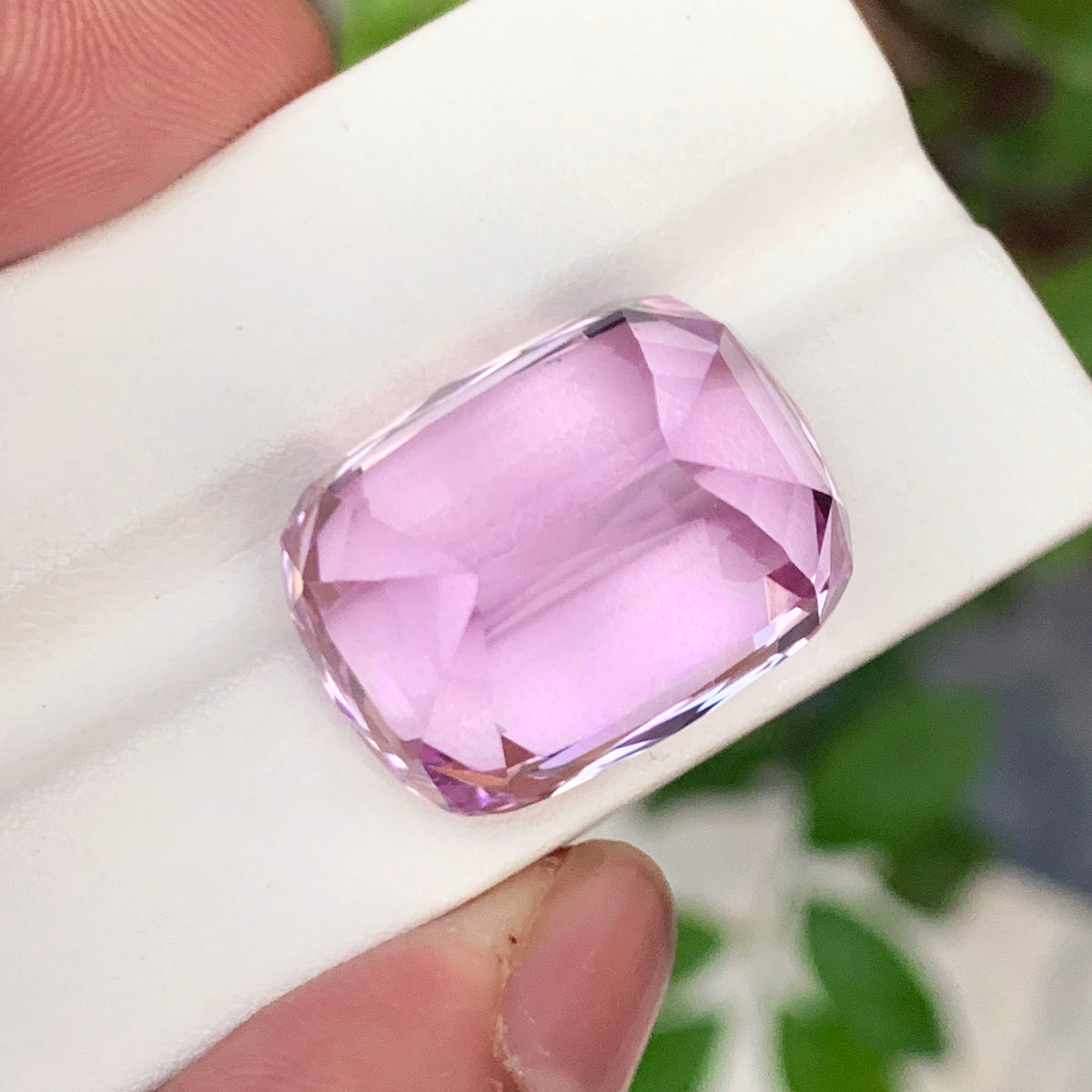 Kunzite gemstone dimensions 23 by 18 by 16 mm
Cushion cut kunzite stone back angle view
Lilac pink color detail on kunzite gemstone