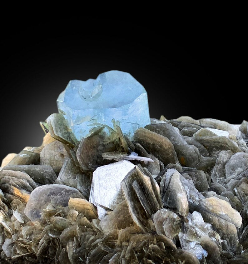 Natural aquamarine amazing color excellent luster
Large aquamarine specimen with silvery muscovite mica