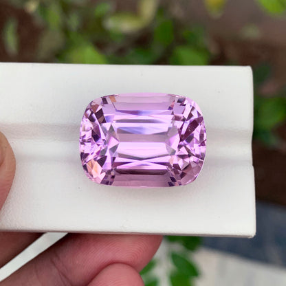 Loose kunzite gemstone for pendant setting
Collector grade kunzite stone from Afghanistan
Kunzite gemstone lighting and clarity detail
Cushion cut facet pattern on kunzite stone