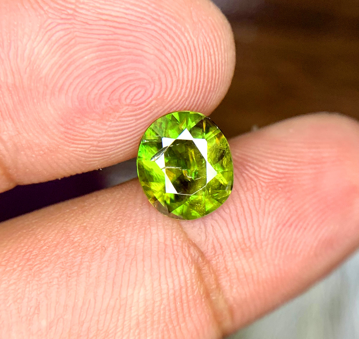 Sphene gemstone from Skardu, Pakistan, macro detail
Natural sphene stone showing color and brilliance
Loose oval sphene gemstone, larger center stone size