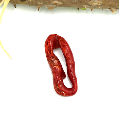 Mediterranean red coral branch showing natural color
Undyed coral branch 40x10mm close-up detail