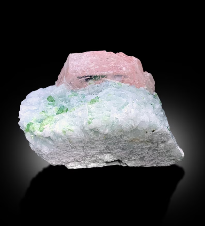 Morganite crystal termination showing natural chip
Full profile of morganite and tourmaline combination