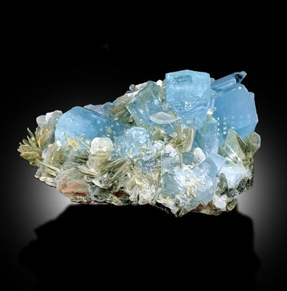 Muscovite mica detail on aquamarine specimen
Natural aquamarine crystal cluster, front angle view