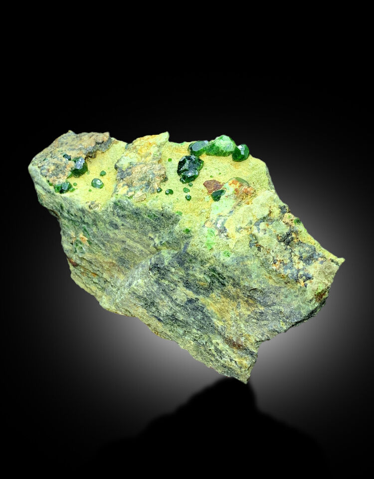 Premium green garnet collector piece
Bright green crystal formation on matrix
