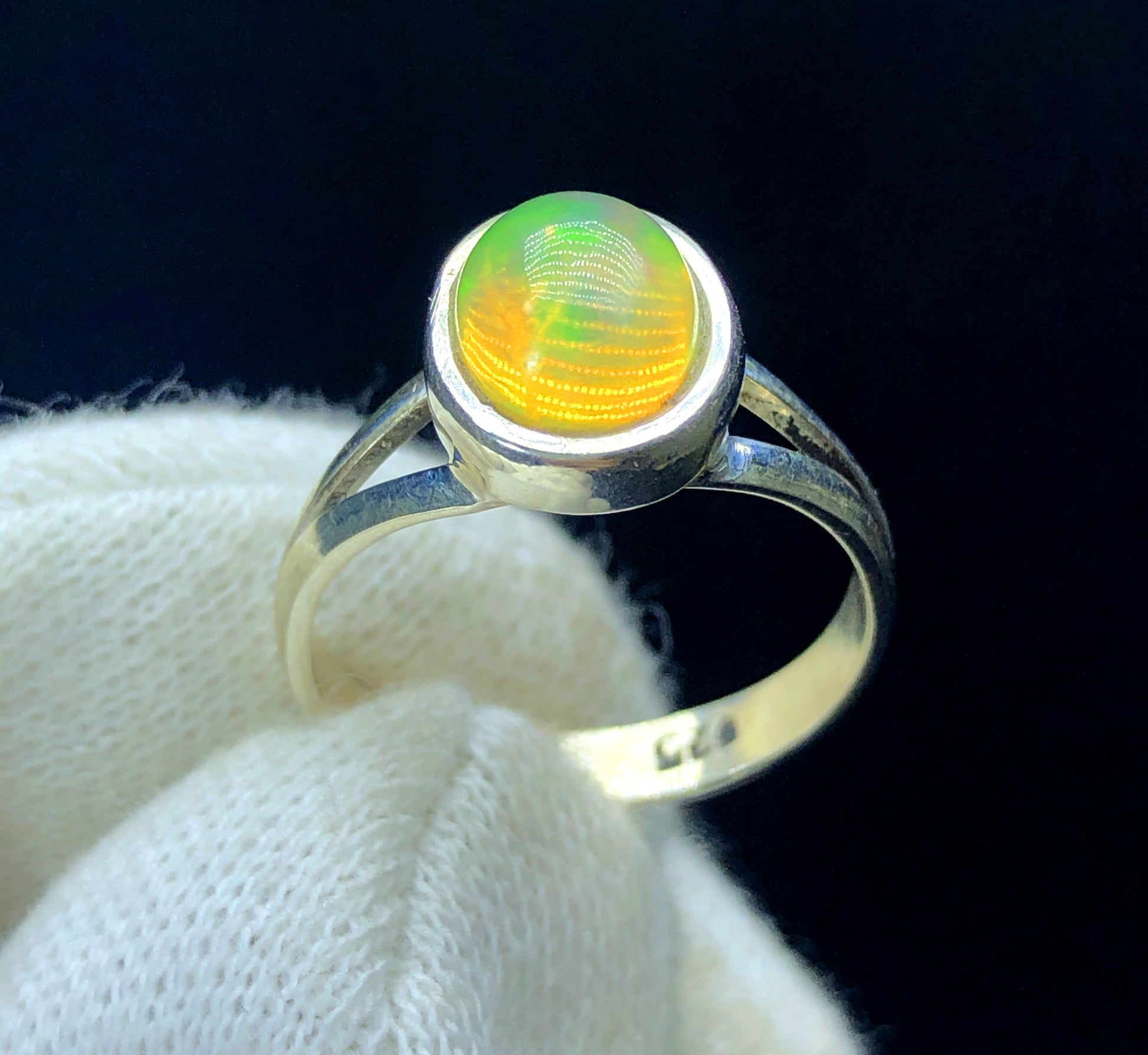 Handmade opal ring made in Ethiopia
Natural Welo opal ring 15ct close-up color detail